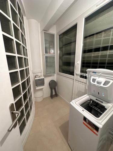 a small kitchen with a stove and a window at Astonishing Luxury Apartment in the South of Paris (NEW!) in Antony