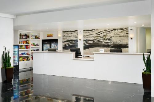 a lobby of a store with a large white counter at Residence Inn by Marriott Philadelphia Center City in Philadelphia