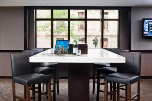 a table with a laptop sitting on top of it at Residence Inn by Marriott Philadelphia Center City in Philadelphia