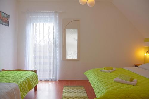 Posteľ alebo postele v izbe v ubytovaní House Plitvice