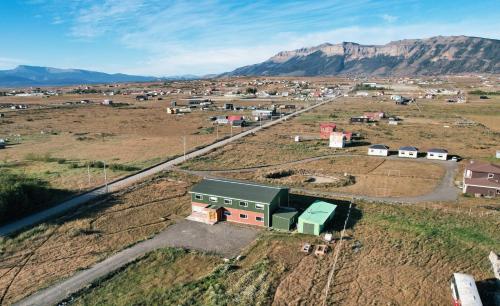 an aerial view of a small village in the mountains at Hotel Casa Verde in Puerto Natales