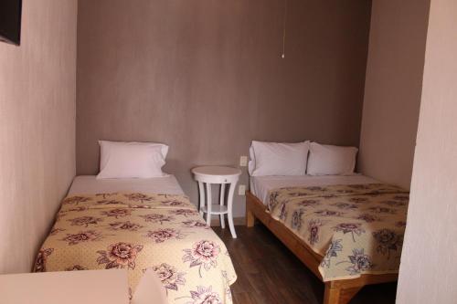 Postel nebo postele na pokoji v ubytování Hotel el Rinconcito Yuriria Gto