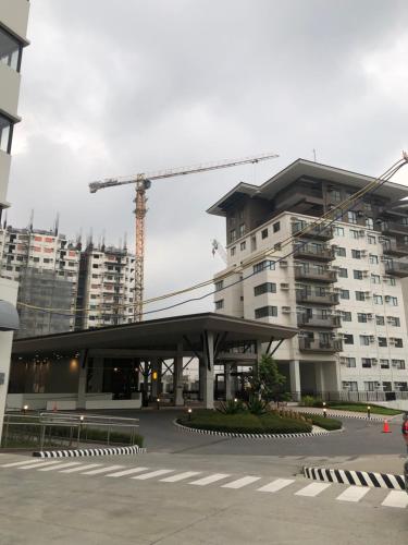 a building under construction with a crane in the background at Wjbca Staycation in Tagaytay