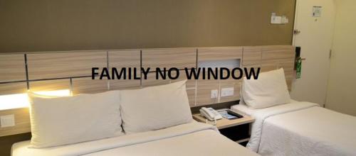 Una cama o camas en una habitación de U Design Hotel Temerloh
