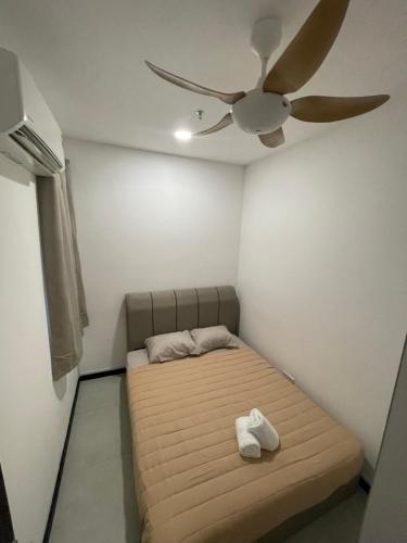 Säng eller sängar i ett rum på Neu Suites @ 3rdNvenue