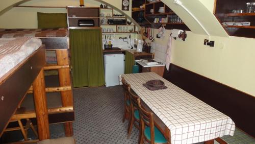 a small kitchen with a table in a room at Ranch Eden, Jeseník in Jeseník