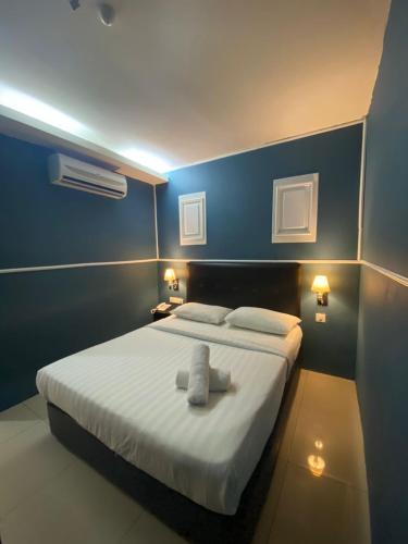 Ένα ή περισσότερα κρεβάτια σε δωμάτιο στο Best View Hotel Sunway Mentari