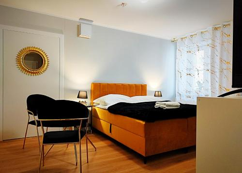 Posteľ alebo postele v izbe v ubytovaní Hugo Star Apartments