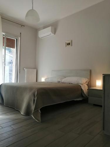 Postel nebo postele na pokoji v ubytování BabbaroHouse - casa vacanza
