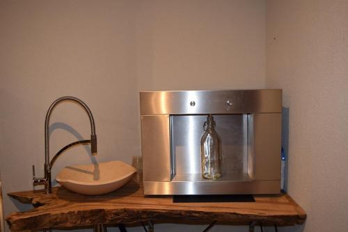 a coffee maker sitting on top of a counter at "CASABANA" - relax tutto l'anno - giardino - piscina Top in Malcesine