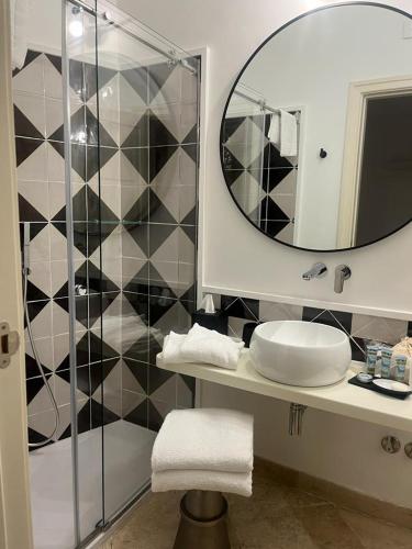 a bathroom with a sink and a mirror at Hotel Orsa Maggiore in Anacapri