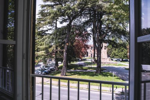 a view from a window of a street at BELVEDERE Luxury Apartment, view on the Lucca Walls in Lucca