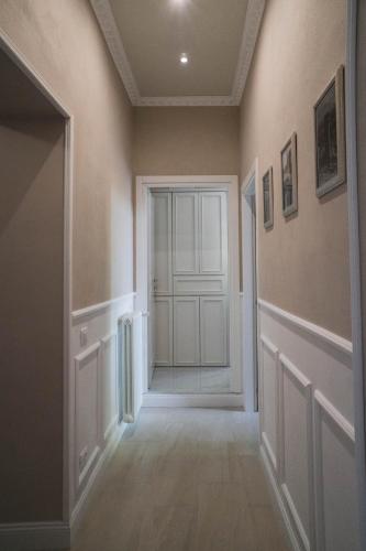 an empty hallway with a door in a room at BELVEDERE Luxury Apartment, view on the Lucca Walls in Lucca