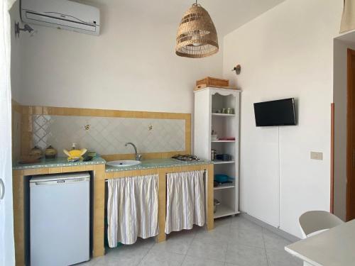 a kitchen with a sink and a dishwasher at Rosa Dei Venti Marettimo in Marettimo