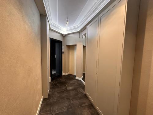 a corridor of a hallway with at DK Premium Warmińska Secesja in Olsztyn