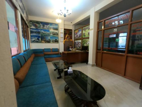 a waiting room with a couch and a table at Hotel Silver Jubilee in Kathmandu