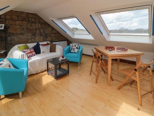 a living room with a couch and a table at 19 Duke Street in Alnwick