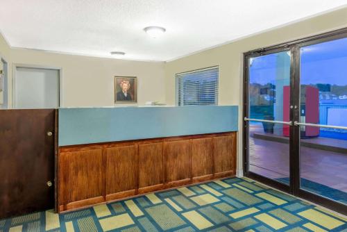 an office lobby with a view of a balcony at Days Inn by Wyndham Hannibal in Hannibal