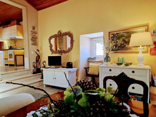 a living room with a couch and a table at Casa das Azenhas by Lisbon Village Apartments in Sintra