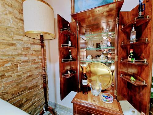 a room with a vanity with a mirror and a lamp at Casa das Azenhas by Lisbon Village Apartments in Sintra