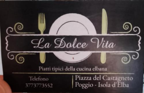 a sign for a restaurant with a plate and fork at La Casalina dell'Elba in Marciana