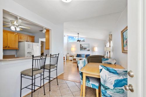 a kitchen and dining room with a table and chairs at The Ringling Beach House in Siesta Key