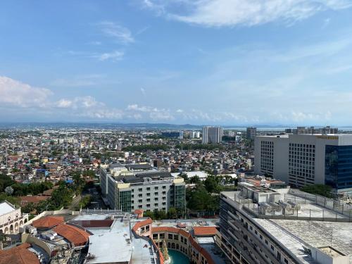 an aerial view of a city with buildings at nJoy! BOHO Luxury at Venice Grand Canal - perfect for business & couples in Manila