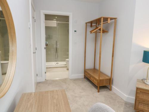 a bathroom with a mirror and a toilet in a room at Sebastian's View in Falmouth