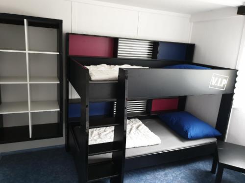 a room with two bunk beds in a room at Juniorcamp Nová Živohošť in Křečovice