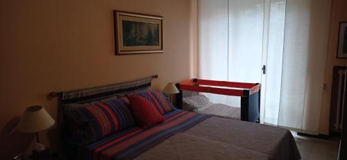 a bedroom with a bed with a table on it at La casa di Miretta in Chieti