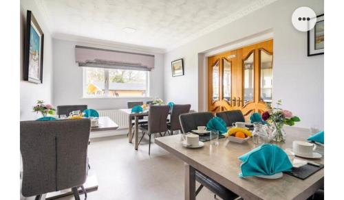a dining room with a table and chairs at Cullentra House in Cushendall