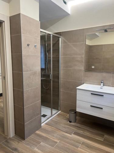 a bathroom with a shower and a sink at Appartamento Monte in Ponte Caffaro