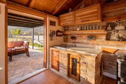 a kitchen with a sink and a counter top at Villa Big Garden in Primorski Dolac