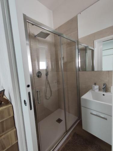 a bathroom with a shower and a sink at Iris Casa Vacanza in Noci