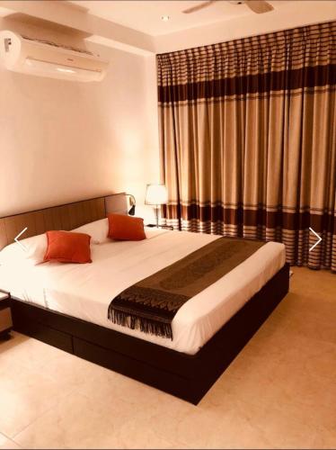 a bedroom with a large bed in a room at Chiang Khan Riverside Bungalows in Chiang Khan