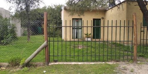 an iron gate in front of a house at Casita de la montaña in Río Ceballos