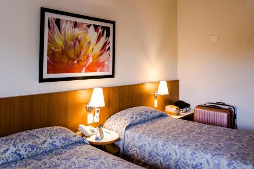 Vitoria Regia Hotel Bauruにあるベッド