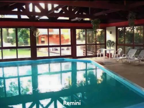 a swimming pool in the middle of a house at Pousada do Serrano - Rua Torta in Gramado