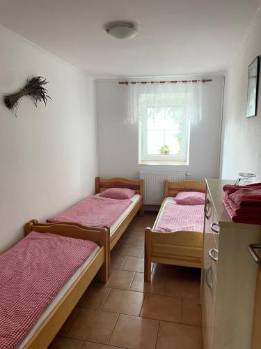 Postel nebo postele na pokoji v ubytování Na úpatí Pálavy