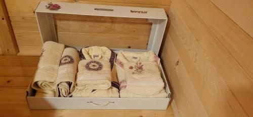 a white box filled with towels in a room at Brvnara Lepota življenja in Dragolj
