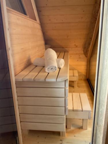 a sauna with two towels sitting on a platform at Blockhaus PanHütte in Braunlage