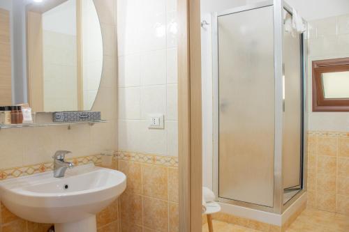 a bathroom with a sink and a shower at Porta delle Botteghelle in Trapani