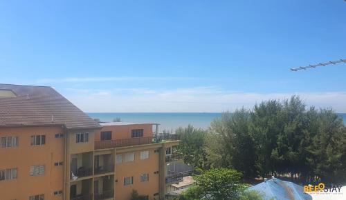 a view of the ocean from an apartment building at Gold Coast Morib Themepark View Studio in Banting