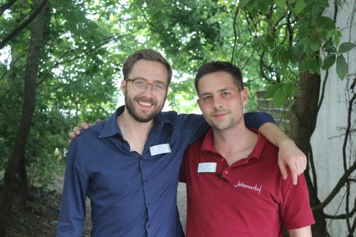 two men are standing next to each other at Johanneshof Gästehaus in Hockenheim