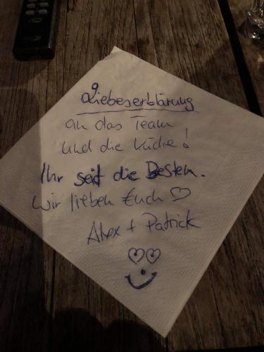 a piece of paper with handwriting on it at Johanneshof Gästehaus in Hockenheim