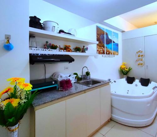 a small kitchen with a sink and a sink at South residence in Manila
