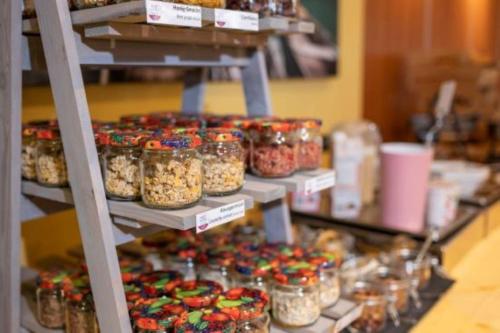 a display of food in jars on a shelf at Posthotel Radstadt in Radstadt