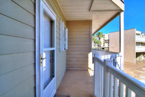 a porch of a house with an open door at Bay Tree B5 in Port Aransas