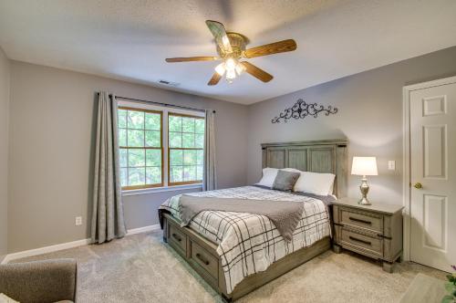 a bedroom with a bed and a ceiling fan at Massanutten Home Rental with Sauna and Game Room! in McGaheysville