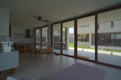 a kitchen and dining room with a table and chairs at Araya Beach Casas in Batangas City
